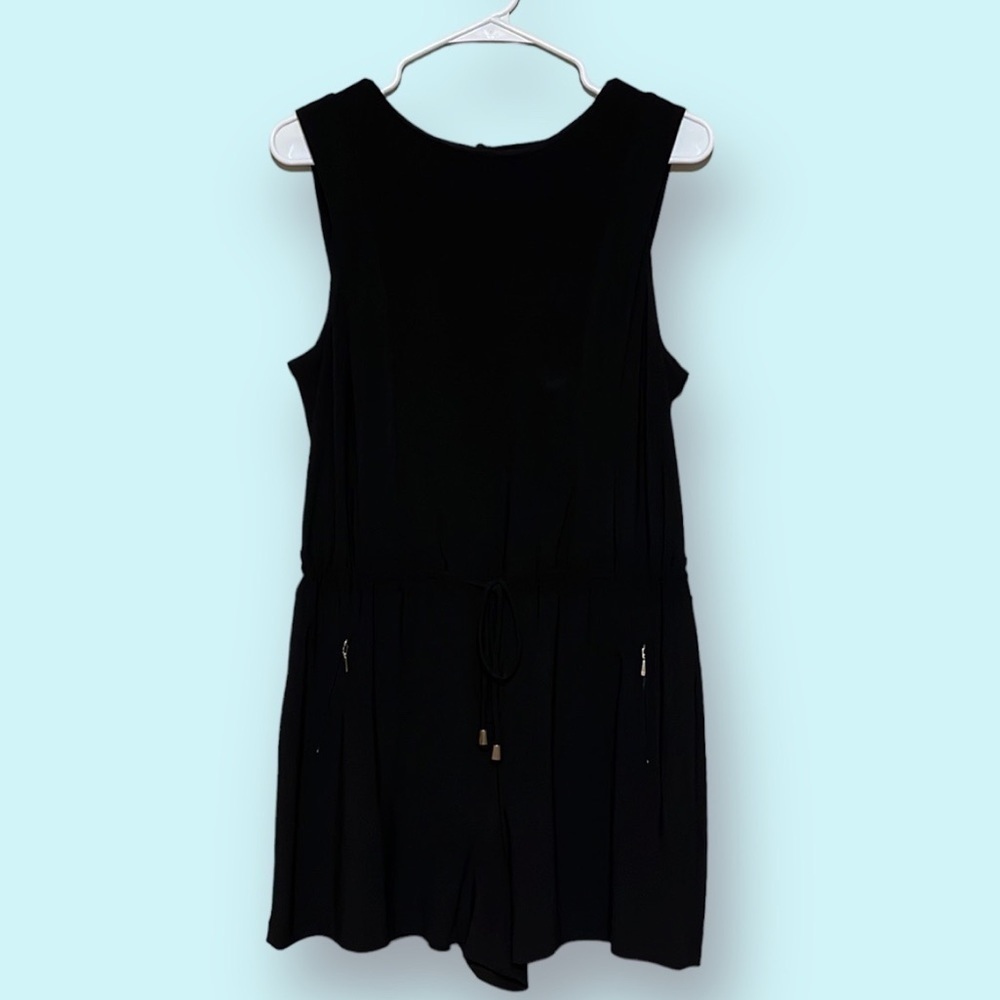 Emma & Mio black romper . Sz. Medium